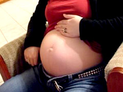 Sexy preggo chick gets naked in her bathroom.
