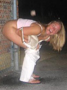 Babe in crimson piddles outdoors unaware of spying