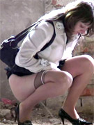 Pretty girl in pantyhose caught on tape doing a piss