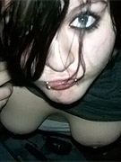 Redheaded punk girl cheslea plays in the sink
