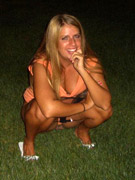 Sweet young beauty squats to have a leak in a yard