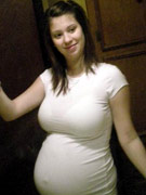 Hot preggo babe oils down her nude body.