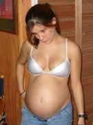 7 months pregnant and showing off her belly