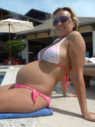 Pregnant jenny getting undressed in her hotel room.