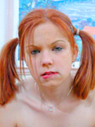 Redhead rose shows off her big boobs and plays with a toy