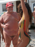 Sunbathing nude babe and her boyfriend slyly filmed