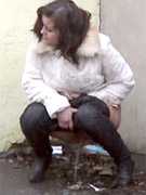 Chick gets on a stepladder to pee on her girlfriend