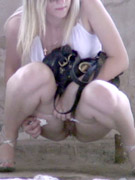 Next she pisses in bucket
