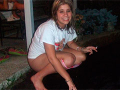 Two unsuspecting chicks make a pee in the open air