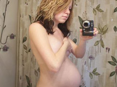 Blonde preggo babe stuffs her wet pussy and ass with a long white dildo